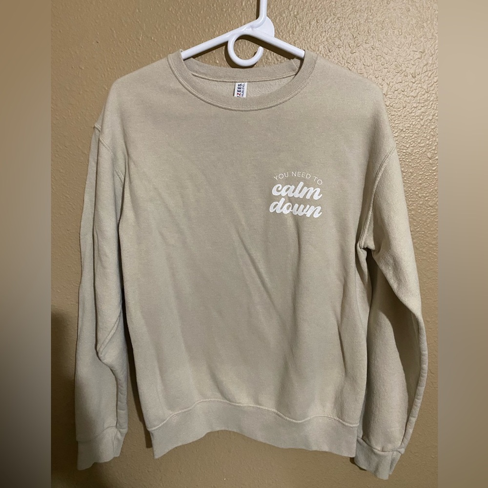 Tan crew neck sweatshirt. Size small.